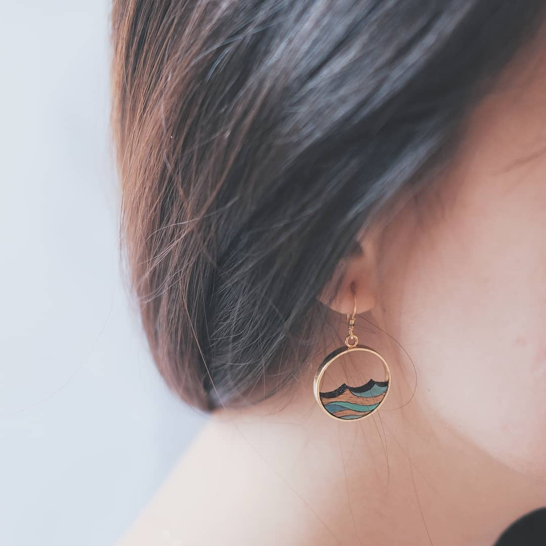 Ocean recycled wood drop earrings worn