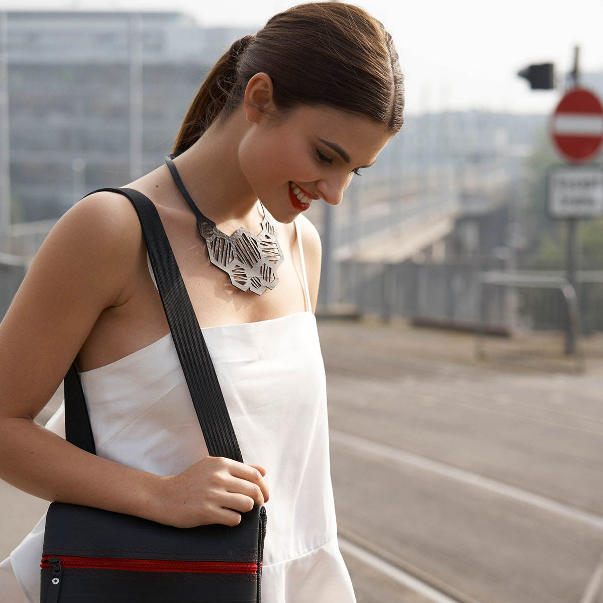 Honeycomb recycled rubber necklace worn on model
