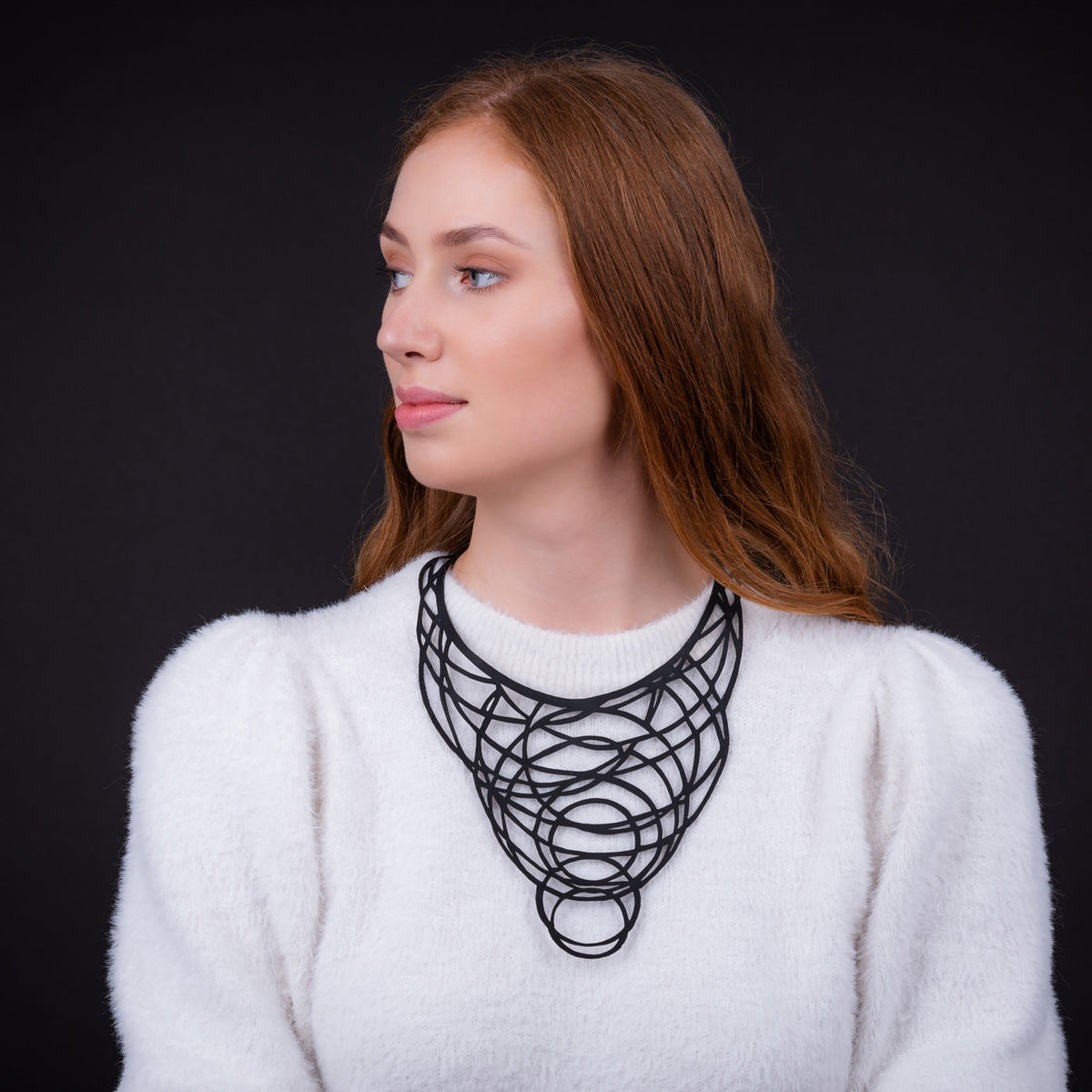 Halo recycled rubber circular necklace worn on model