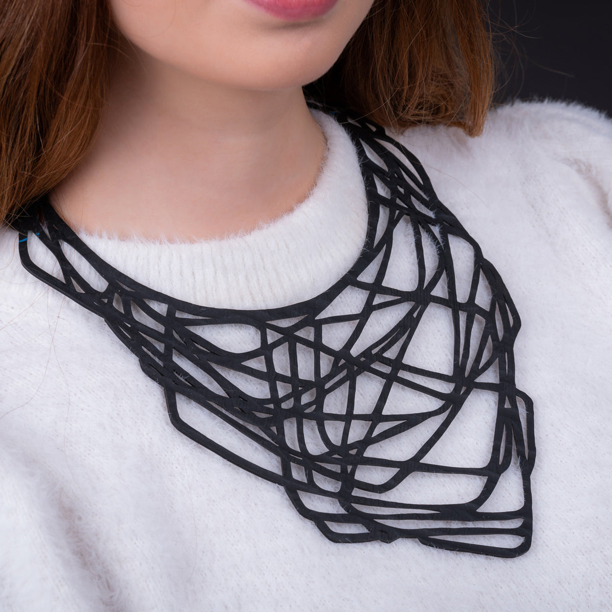 Orion recycled rubber statement necklace worn on model