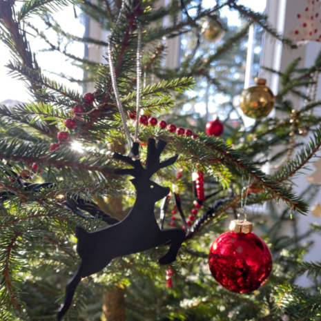 Rudolph recycled rubber reindeer Christmas decoration on display